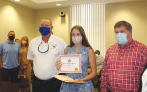 County honors teen for saving siblings from July house fire