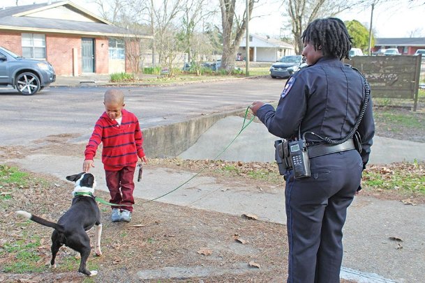 Police walk adoptable dogs to connect with community