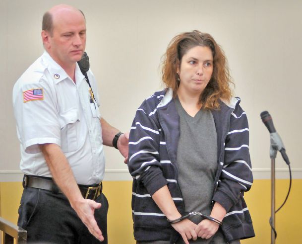 Woman charged in dead babies case