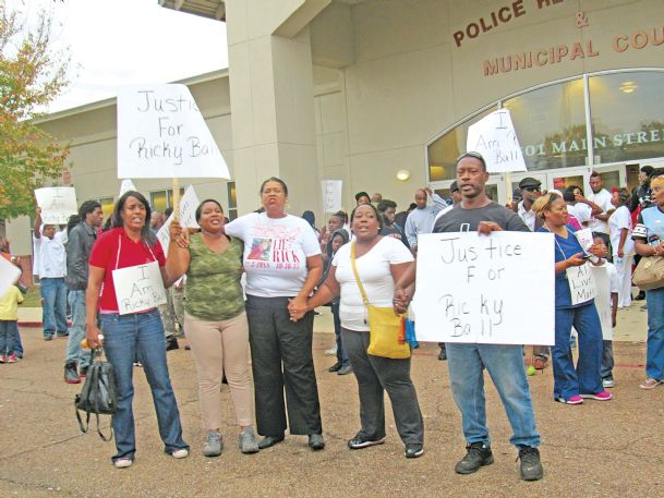 Protesters march to city council meeting