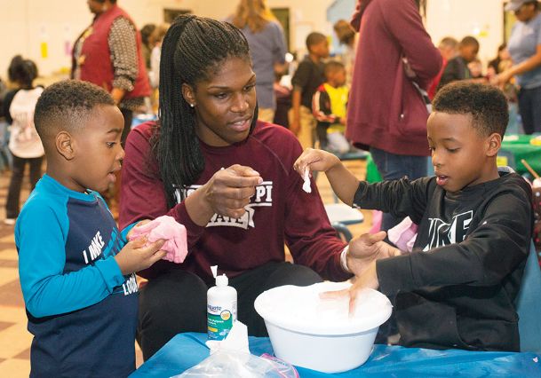 Slime dunk: MSU center McCowan teaches Starkville children how to make slime at Emerson