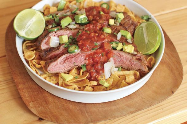 A flank steak Frito pie fit for feeding a crowd
