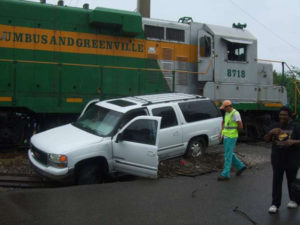 Train hits SUV driven by Columbus man wanted in Jackson