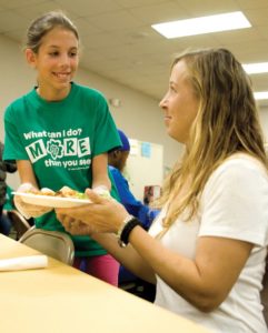 Girl Scouts troop spreads the love at Loaves and Fishes