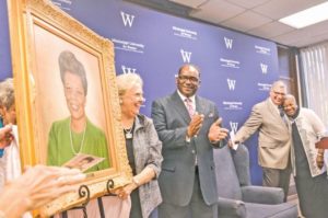 Crowd celebrates beloved educator