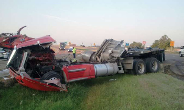 Overturned tractor-trailer holds up traffic