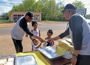 In the neighborhood: Group of church members supply food from pop-up soup kitchen on Northside