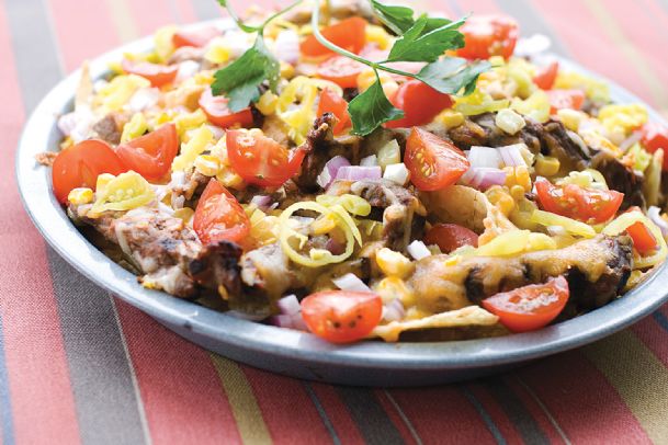 Moving nachos out of the microwave, onto the grill