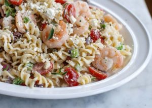 Elevate the basic pasta salad with feta and shrimp