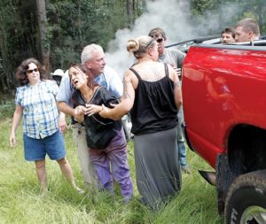 Motorists help woman, sister pinned in burning car