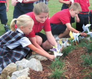 Pinwheels for Peace: Annunciation Catholic School students demonstrate what peace means to them