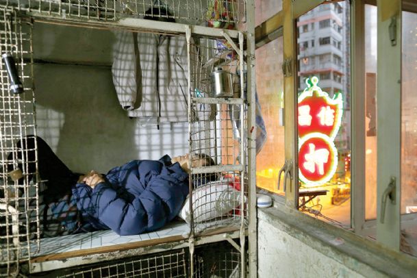 In wealthy Hong Kong, poorest live in cages