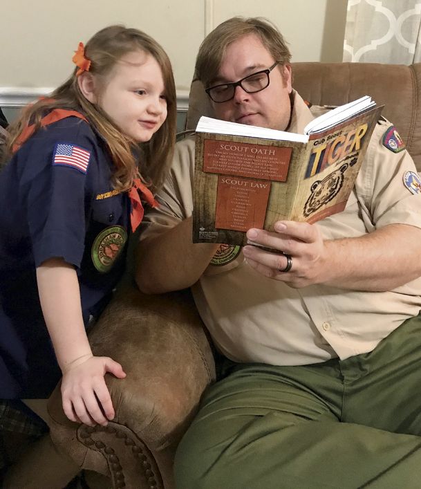 girl scouts taking oath