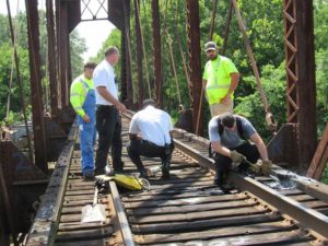 Bottle rockets set fire to railroad trestle over Tombigbee