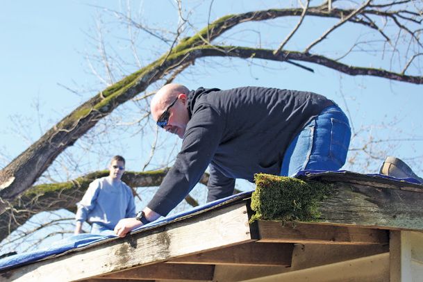 A month after tornado, volunteers still cleaning up