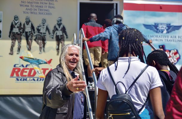 Breaking barriers in the sky: Tuskegee Airmen exhibit visits local middle schools