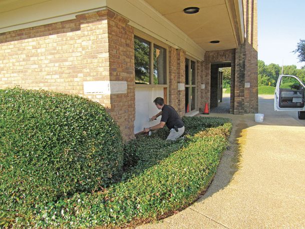 Two suspects on the run after crashing stolen car into bank building