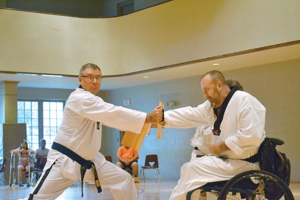 ‘He’s obviously a fighter’: Former Marine fights paralysis, earns third-degree black belt