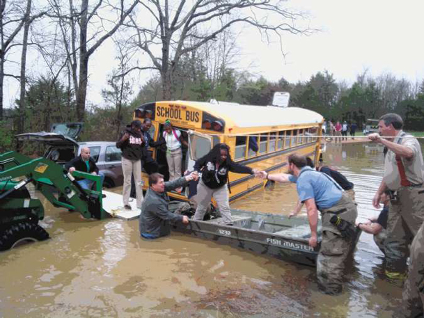 Bus stalls in flooded street in East Oktibbeha