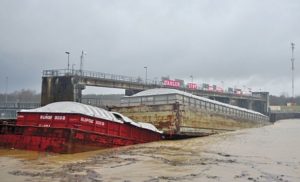 Barge sinks, restricts flow at Lock & Dam