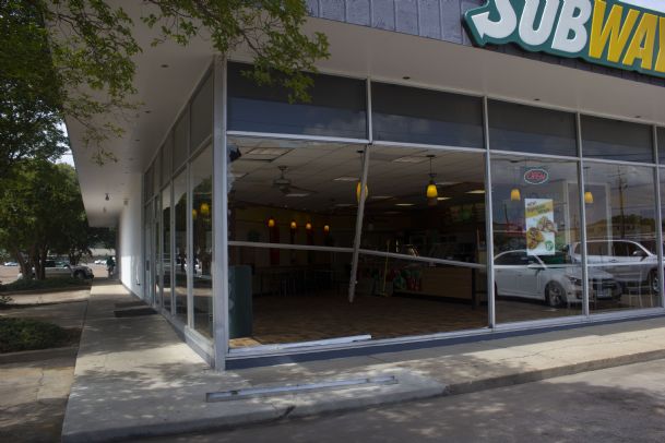 Two injured when car crashes into Subway