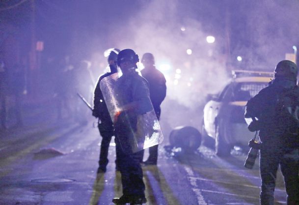In Ferguson, scathing US report brings pressure for change