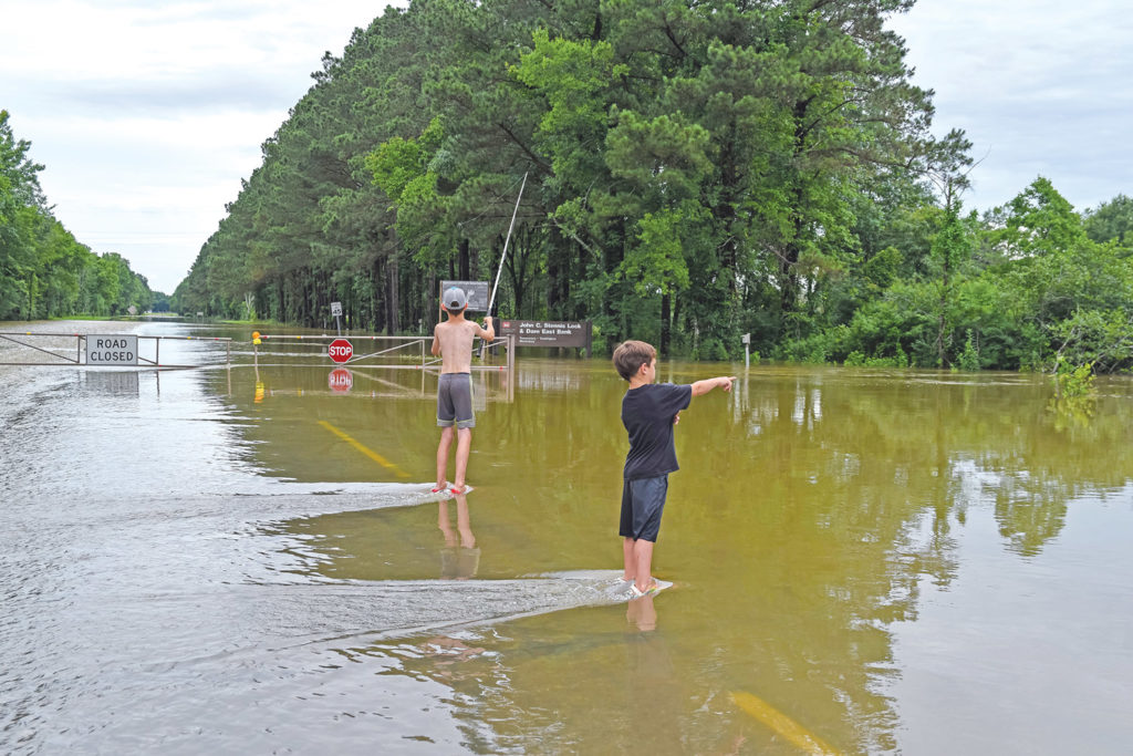 Flooding damages structures, covers roads in Golden Triangle