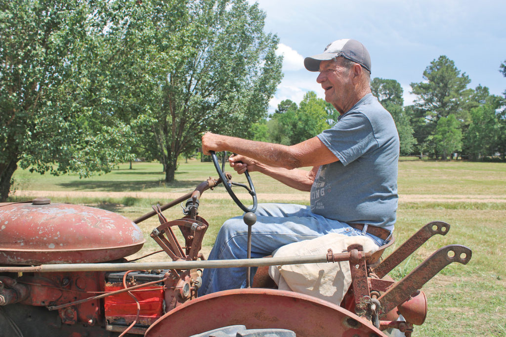 Community Profile: Man and his tractor keep each other going