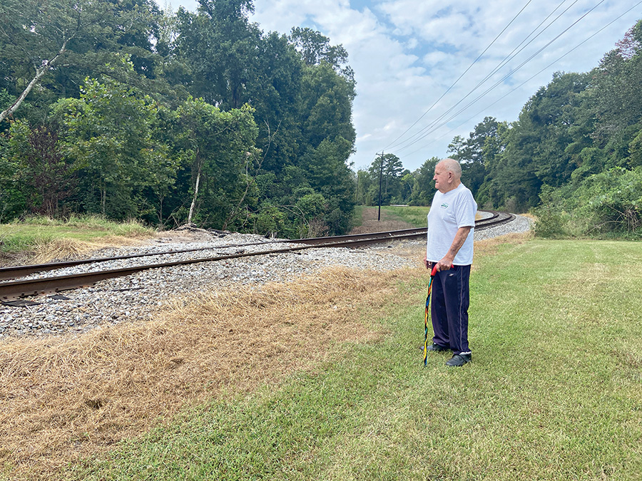 Railroad blocks access to man’s land; threatens to prosecute if he crosses track